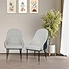  Front view of two PU leather dining chairs with white cushioned seat and vertical stitching

