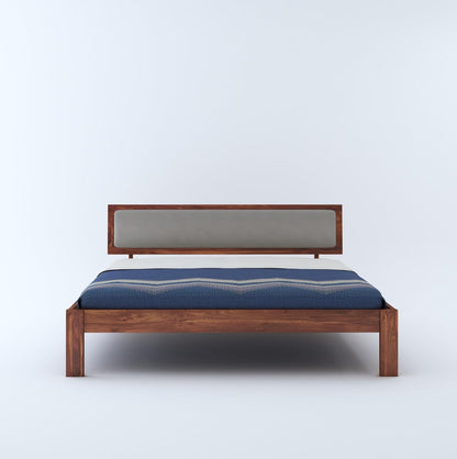 Sheesham wood bed with blue bedsheet

