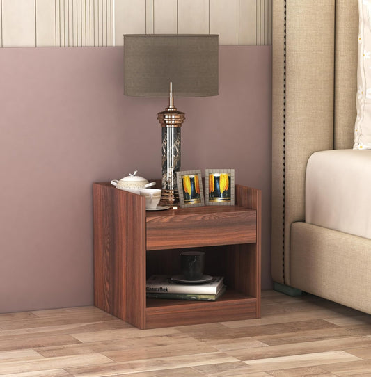 Wooden bedside table with storage placed beside bed