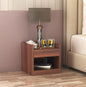 Wooden bedside table with storage placed beside bed